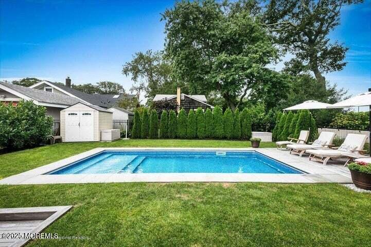 2123 Edgewood Place Spring Lake, NJ 07762 - Photo 17 of 21 a view of pool with lawn chairs and large trees