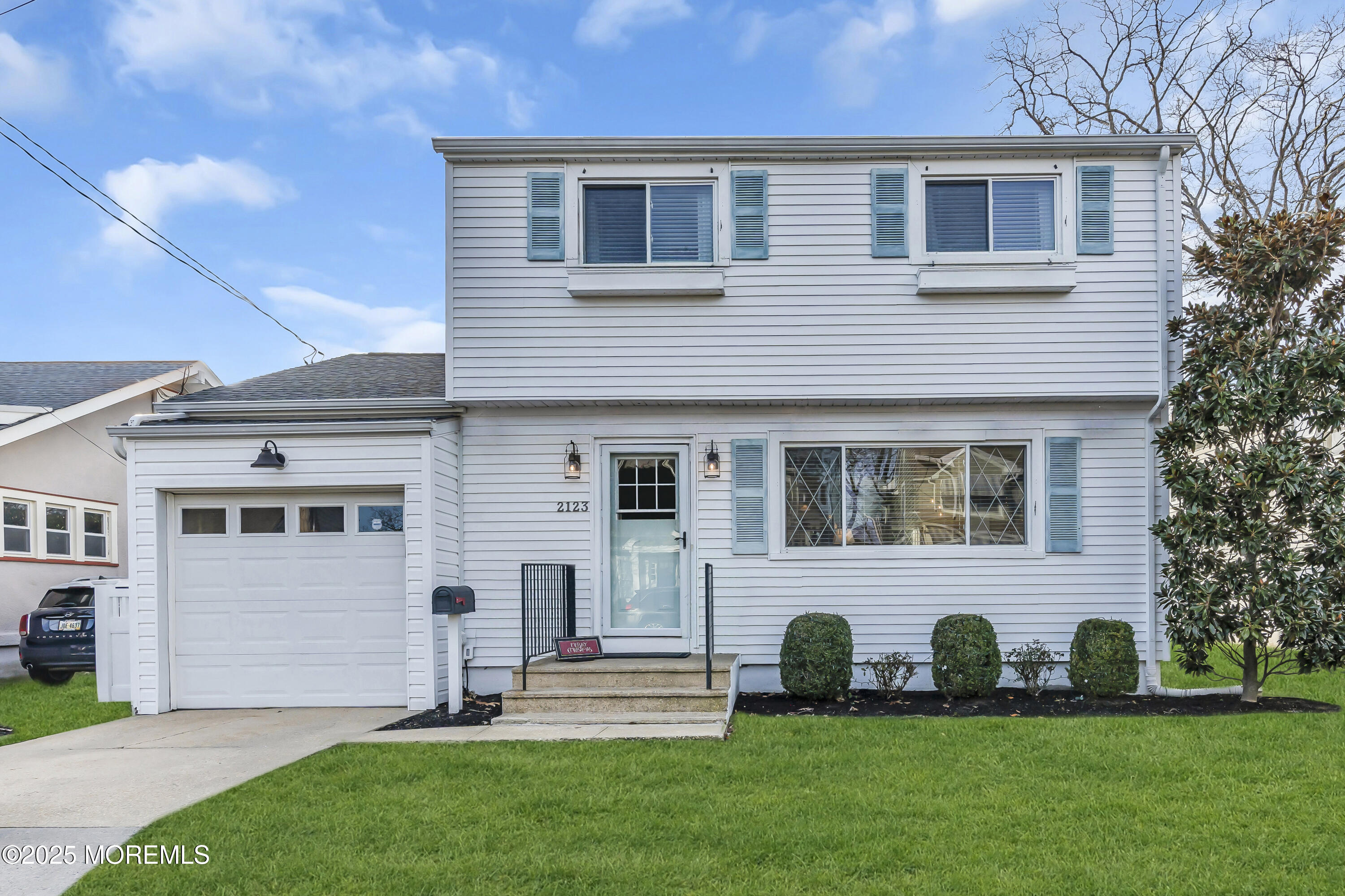 2123 Edgewood Place Spring Lake, NJ 07762 - Photo 3 of 21 a front view of a house with a garden