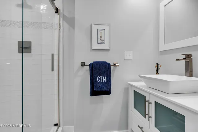 a kitchen with a refrigerator and a sink