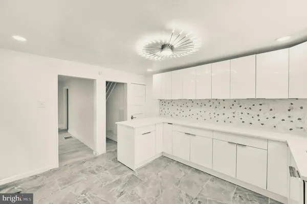 a kitchen with a sink stove and refrigerator