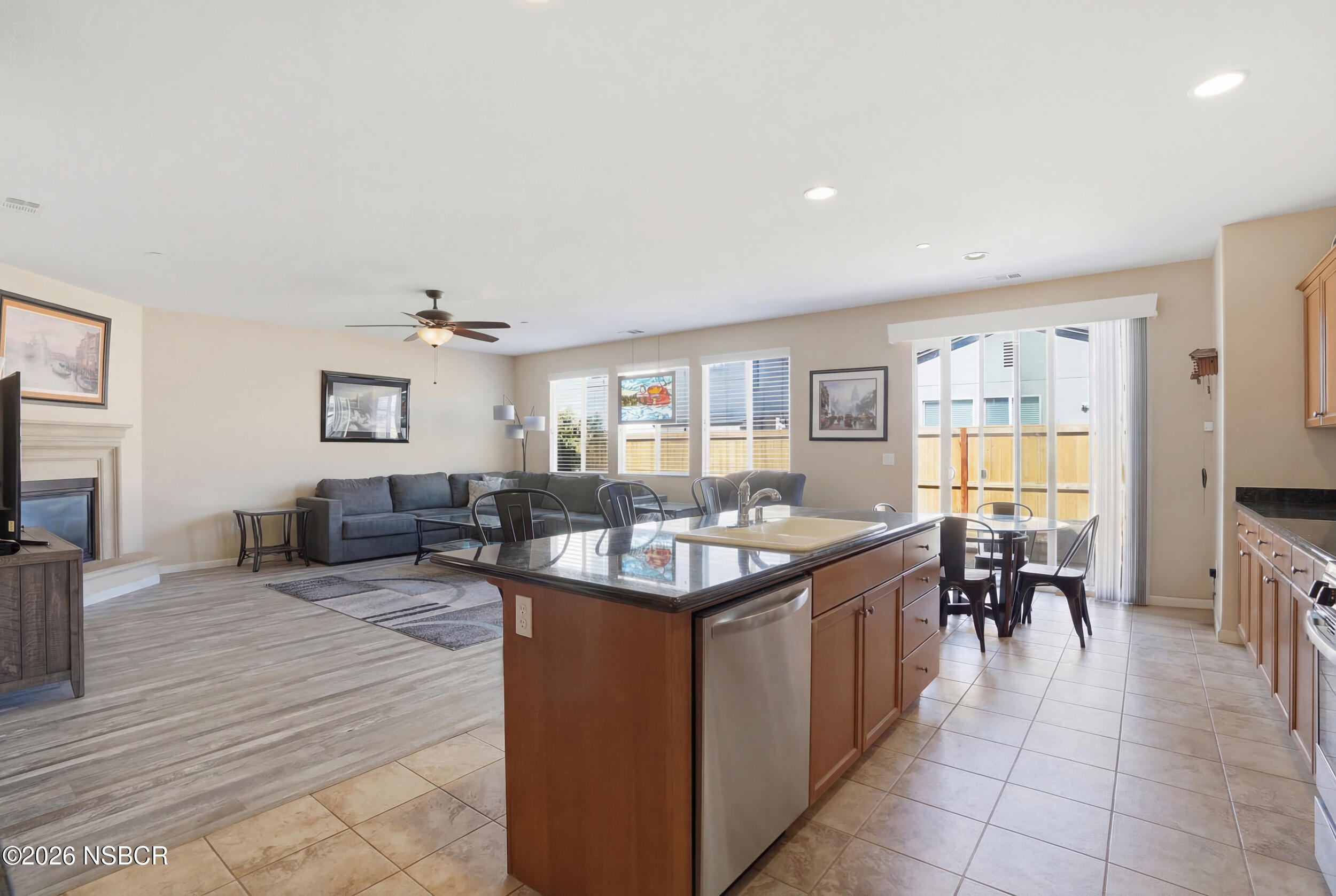 2205 Point Sal Loop Lompoc, CA 93436 - Photo 13 of 36 a living room with couches and kitchen view with wooden floor