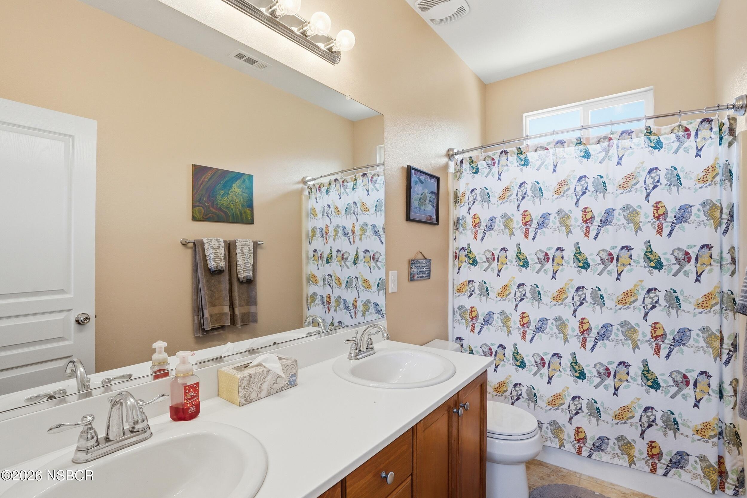 2205 Point Sal Loop Lompoc, CA 93436 - Photo 21 of 36 a bathroom with a sink toilet and shower