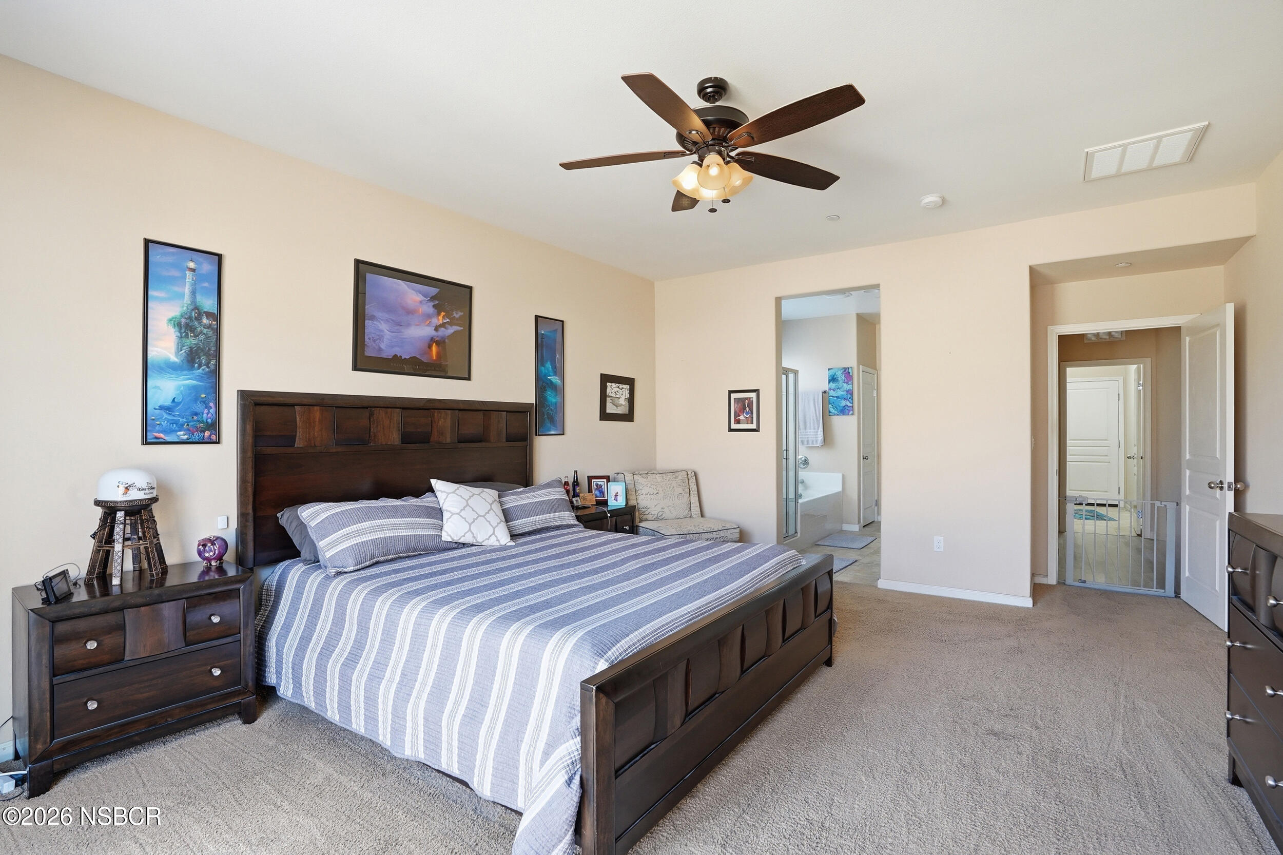 2205 Point Sal Loop Lompoc, CA 93436 - Photo 25 of 36 a bedroom with a bed and a chandelier