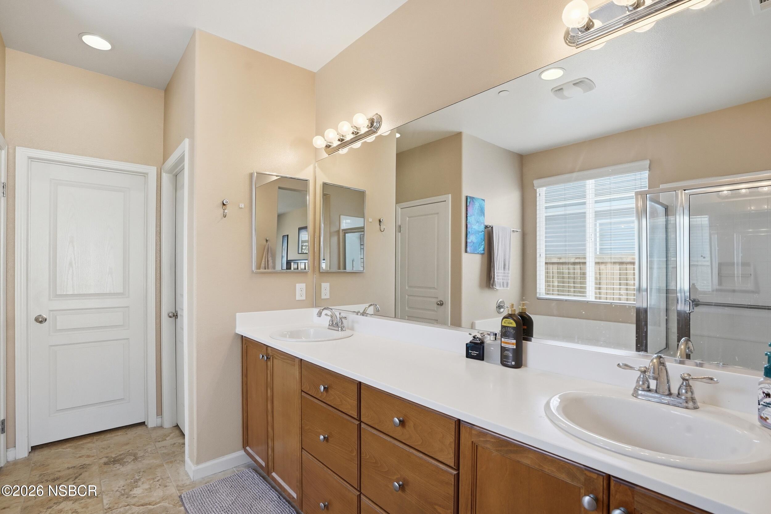 2205 Point Sal Loop Lompoc, CA 93436 - Photo 26 of 36 a bathroom with a double vanity sink mirror and double
