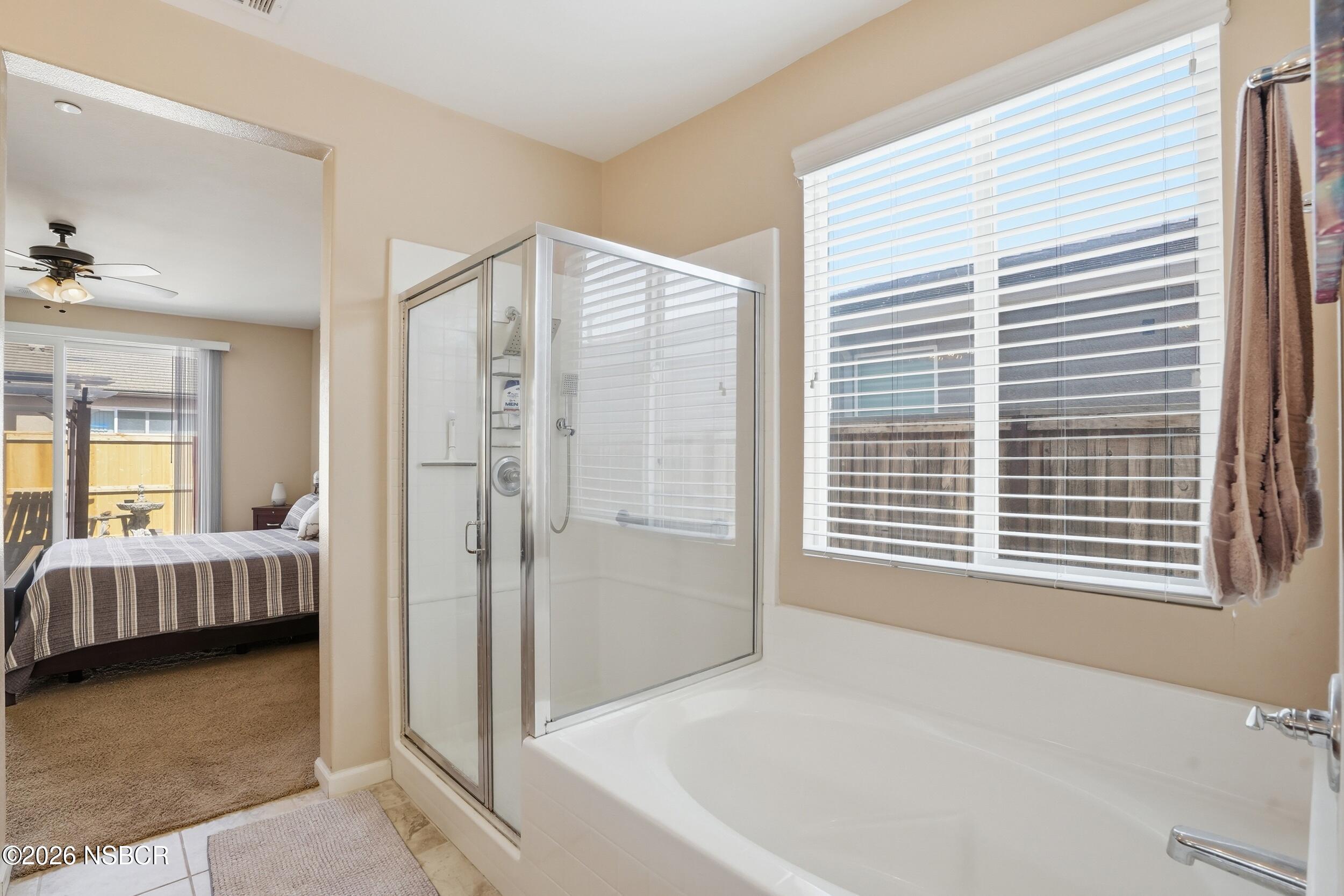 2205 Point Sal Loop Lompoc, CA 93436 - Photo 27 of 36 a bathroom with a tub and a shower