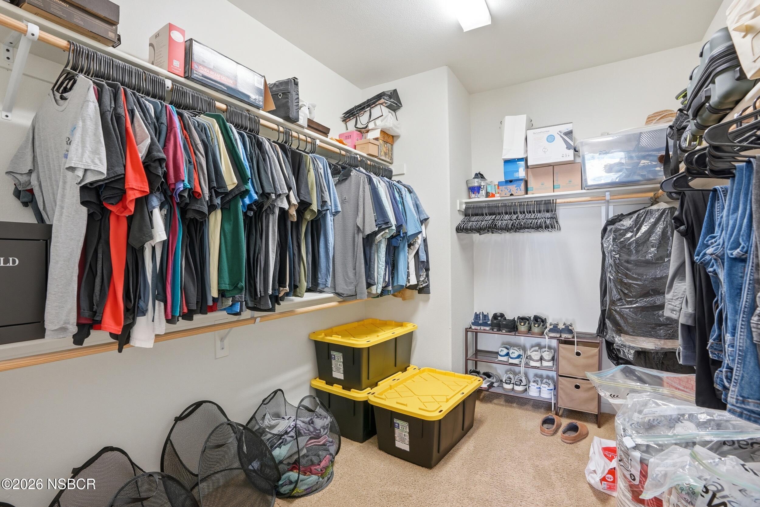 2205 Point Sal Loop Lompoc, CA 93436 - Photo 28 of 36 a view of walk in closet with clothes and shoes