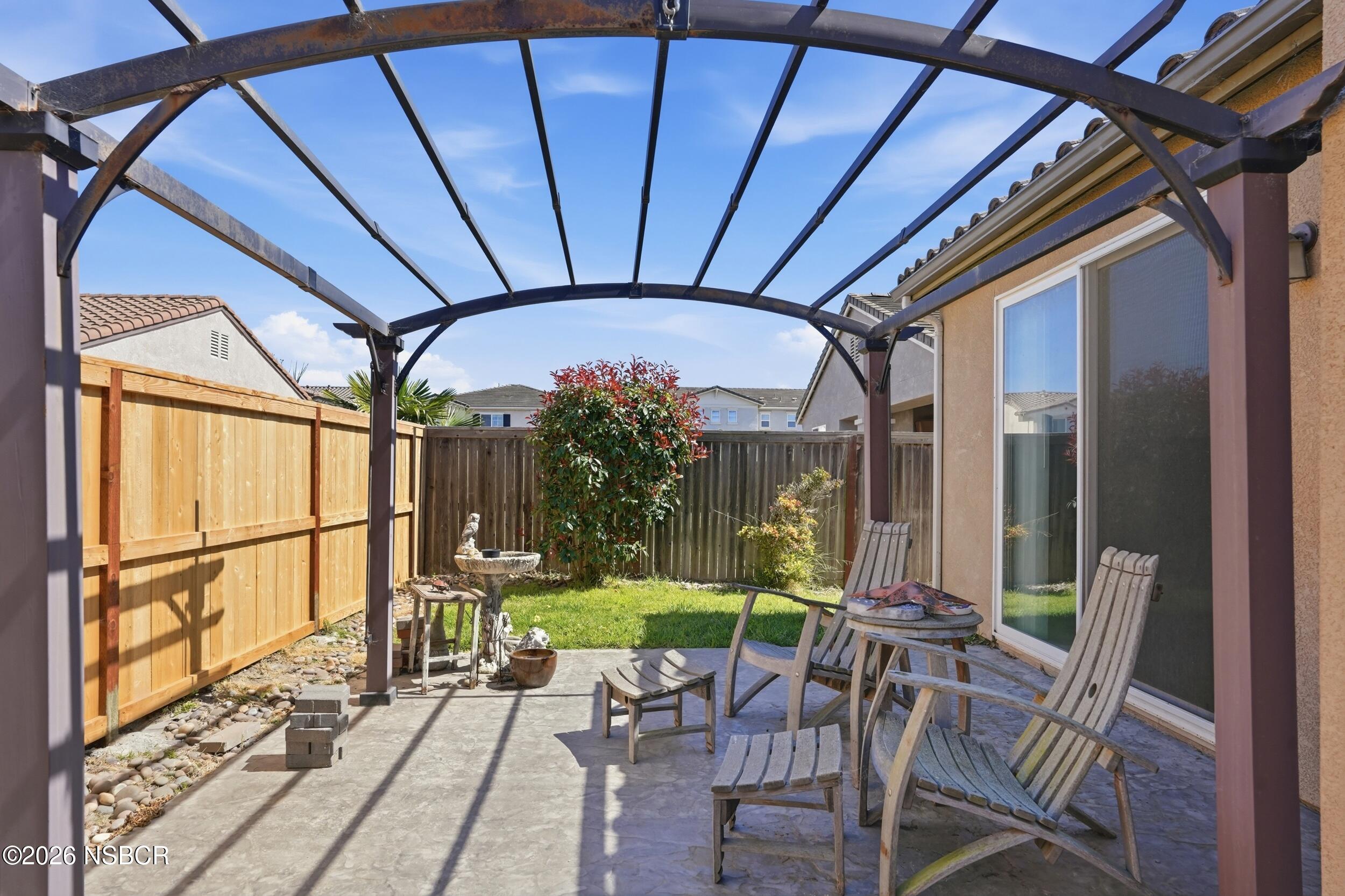 2205 Point Sal Loop Lompoc, CA 93436 - Photo 29 of 36 a patio with a yard table and chairs