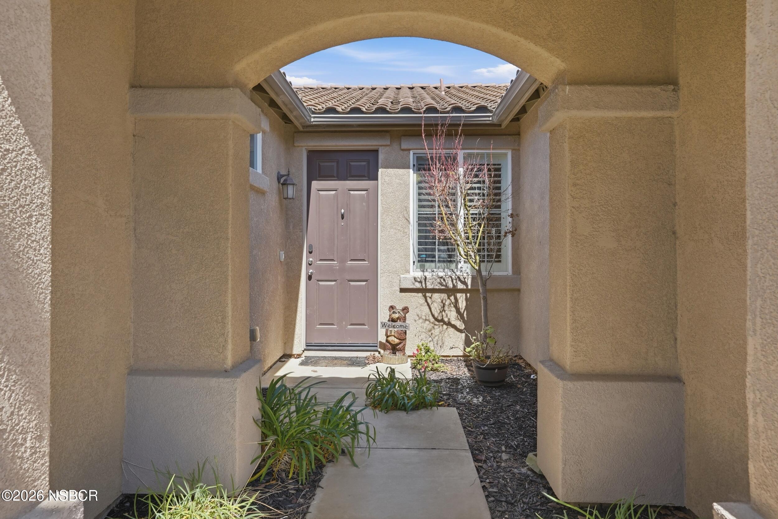 2205 Point Sal Loop Lompoc, CA 93436 - Photo 3 of 36 a front view of a house with garden