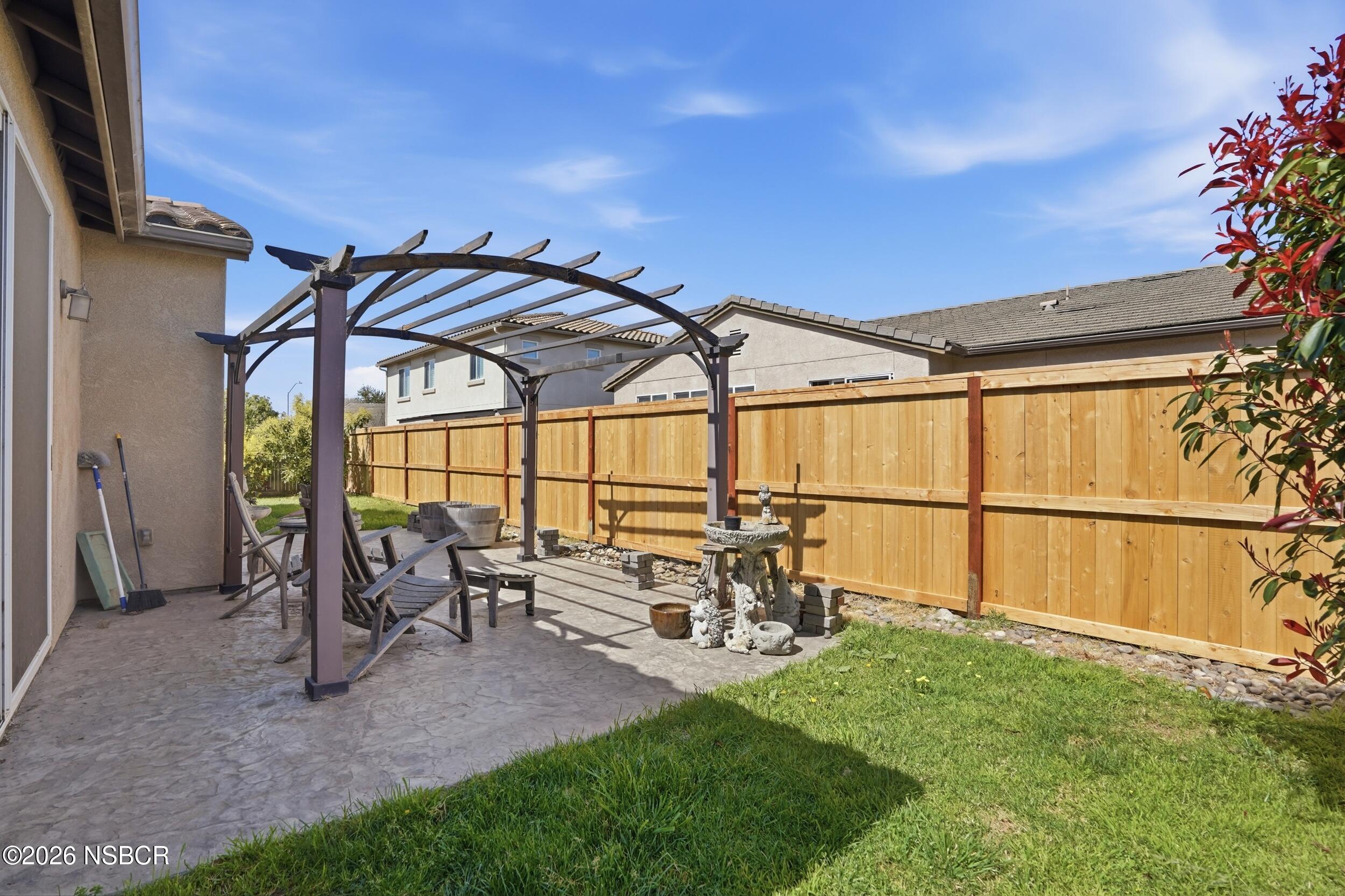 2205 Point Sal Loop Lompoc, CA 93436 - Photo 32 of 36 a view of a patio with table and chairs and potted plants