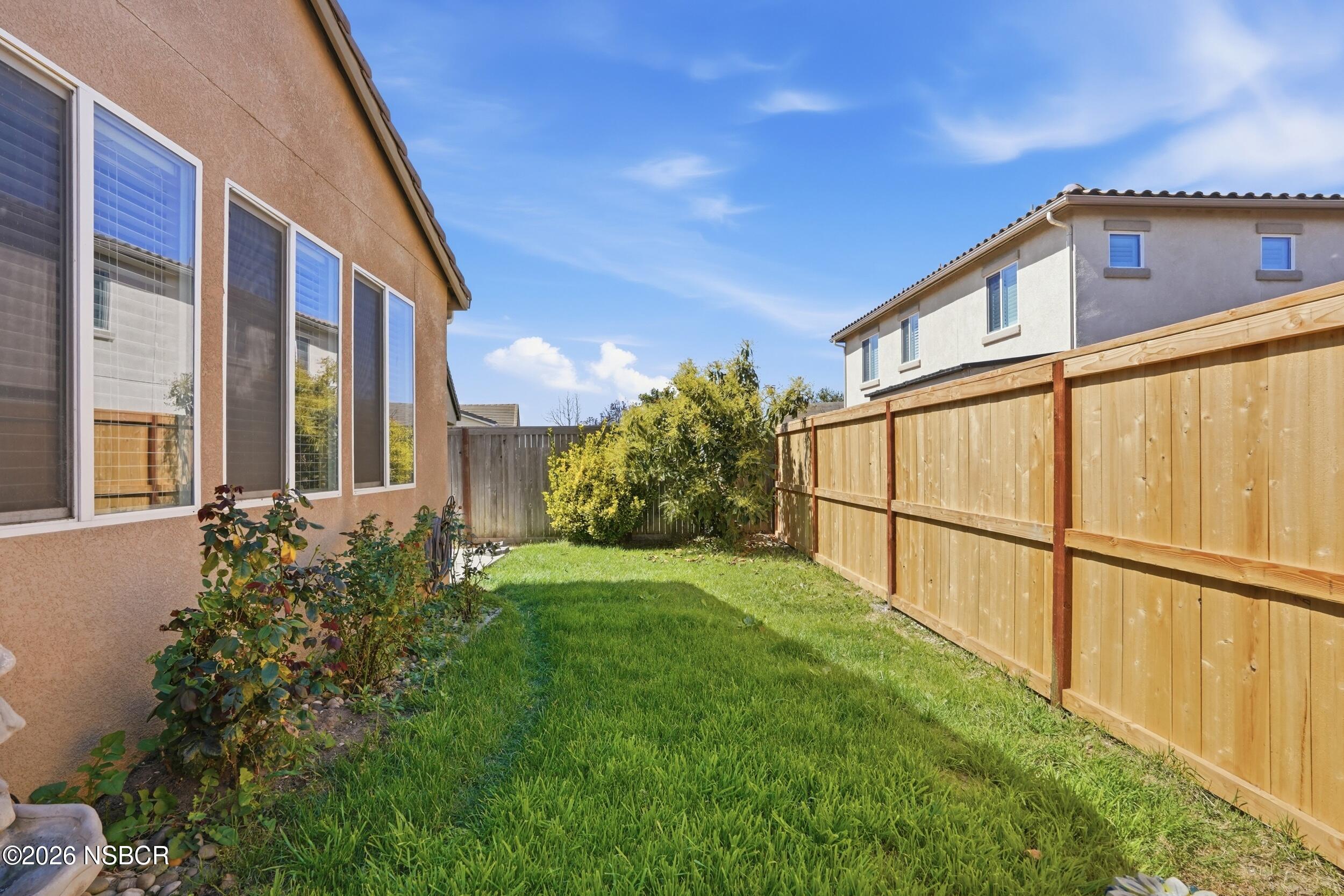 2205 Point Sal Loop Lompoc, CA 93436 - Photo 33 of 36 a view of a backyard with potted plants