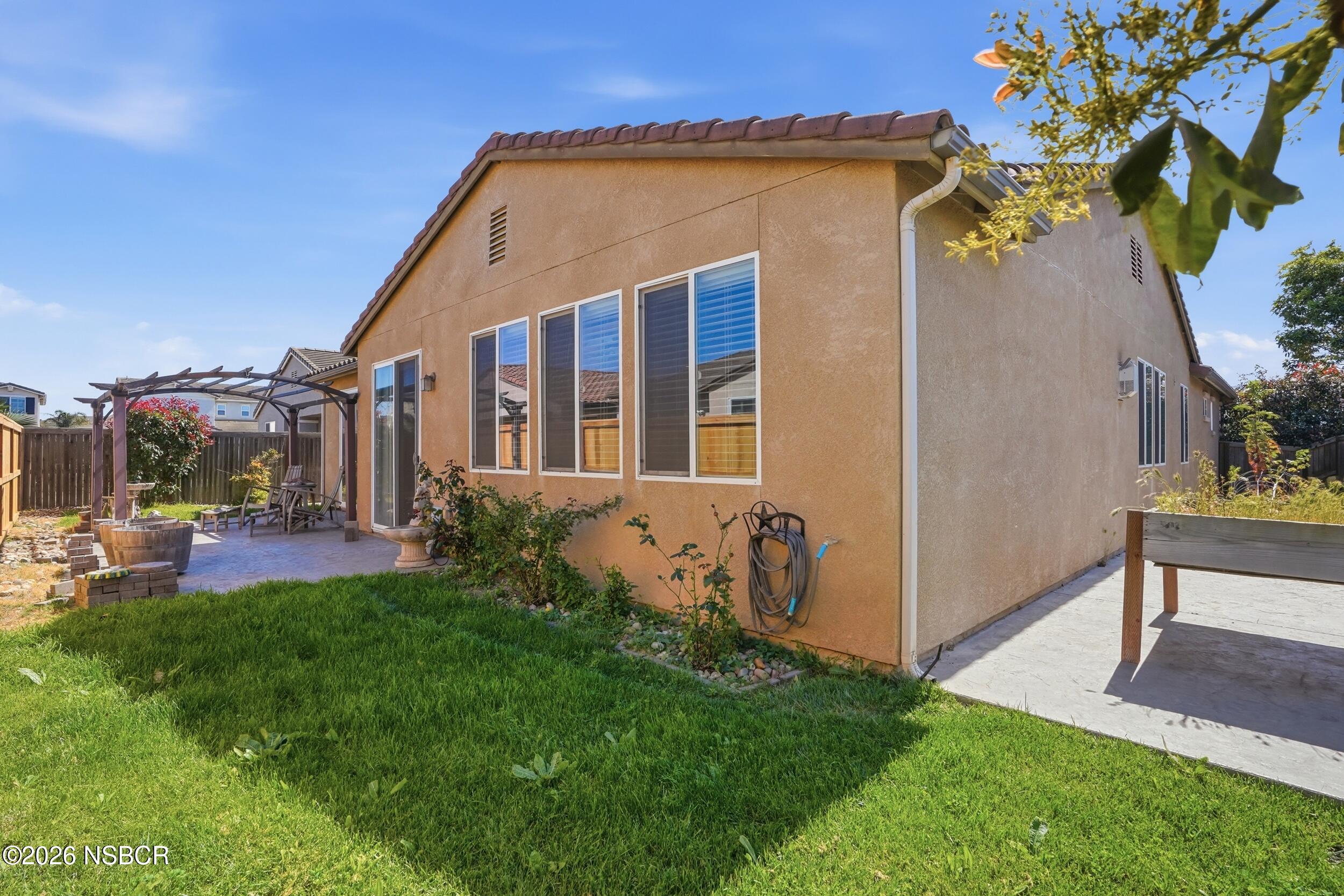 2205 Point Sal Loop Lompoc, CA 93436 - Photo 34 of 36 a front view of a house with a yard