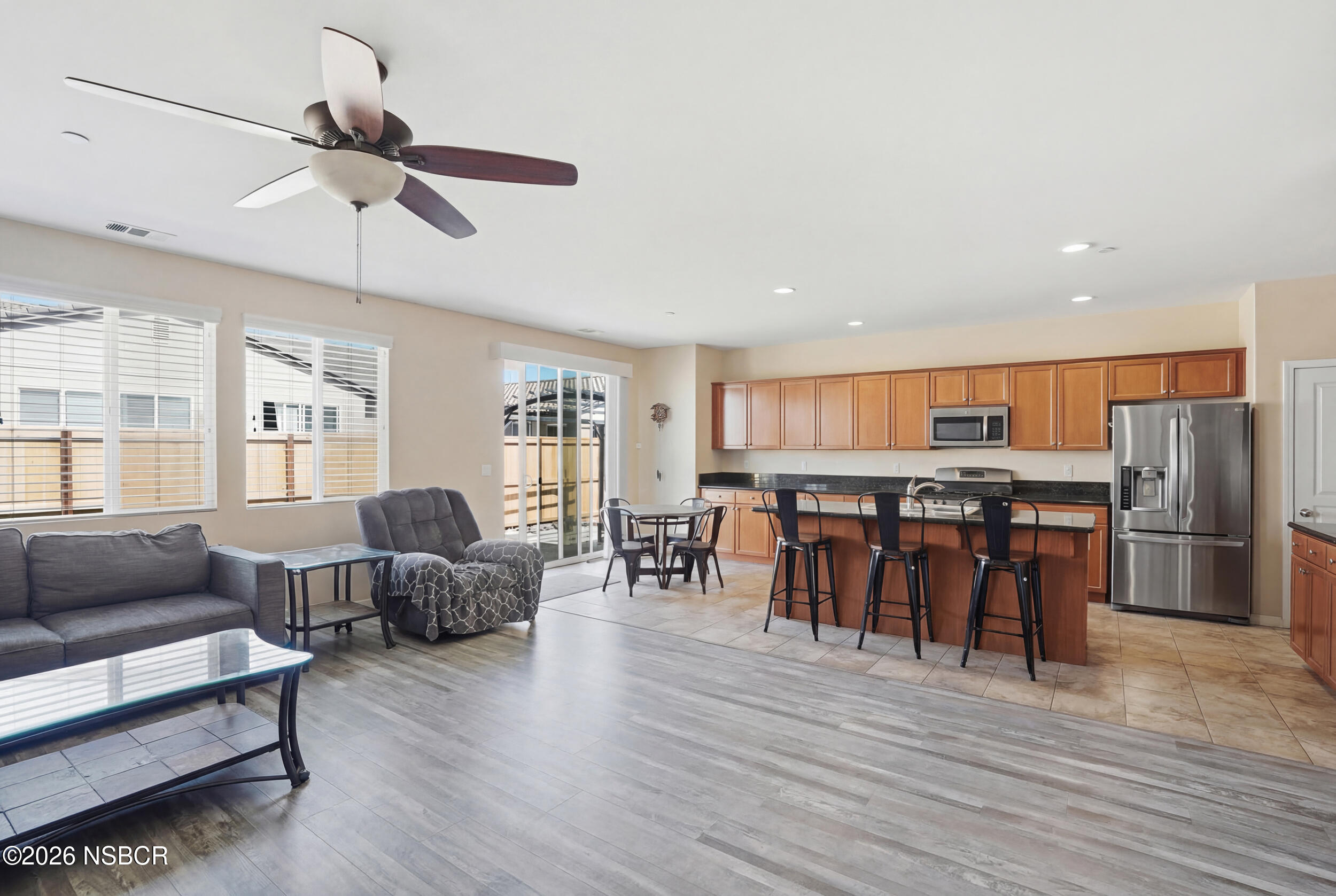 2205 Point Sal Loop Lompoc, CA 93436 - Photo 7 of 36 a living room with furniture kitchen view and a wooden floor
