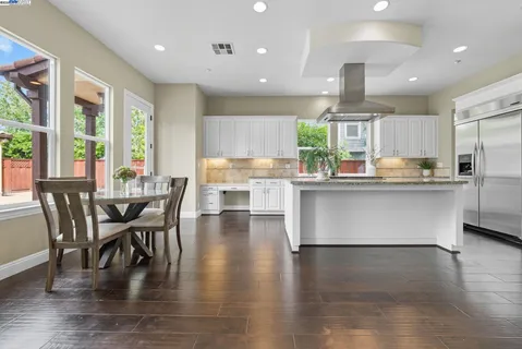 a kitchen with counter top space a sink appliances and cabinets