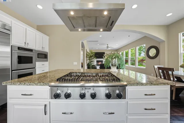 a kitchen with a stove and a microwave