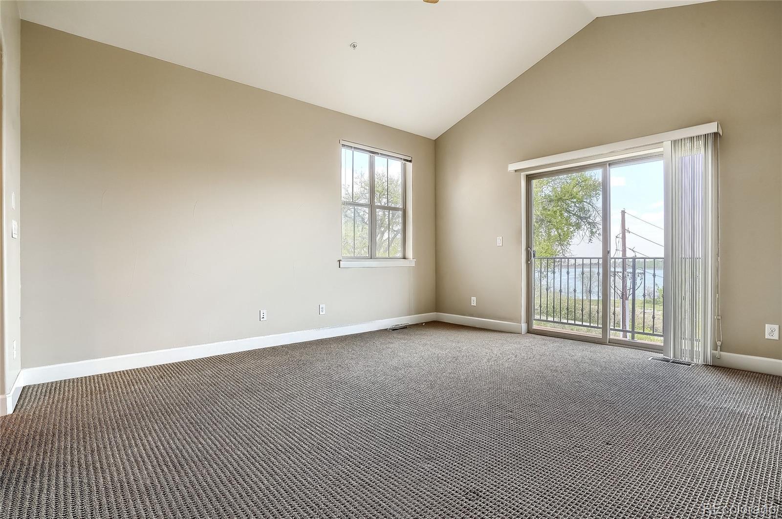 2363 Primo Road, Unit E Highlands Ranch, CO 80129 - Photo 17 of 36 an empty room with windows
