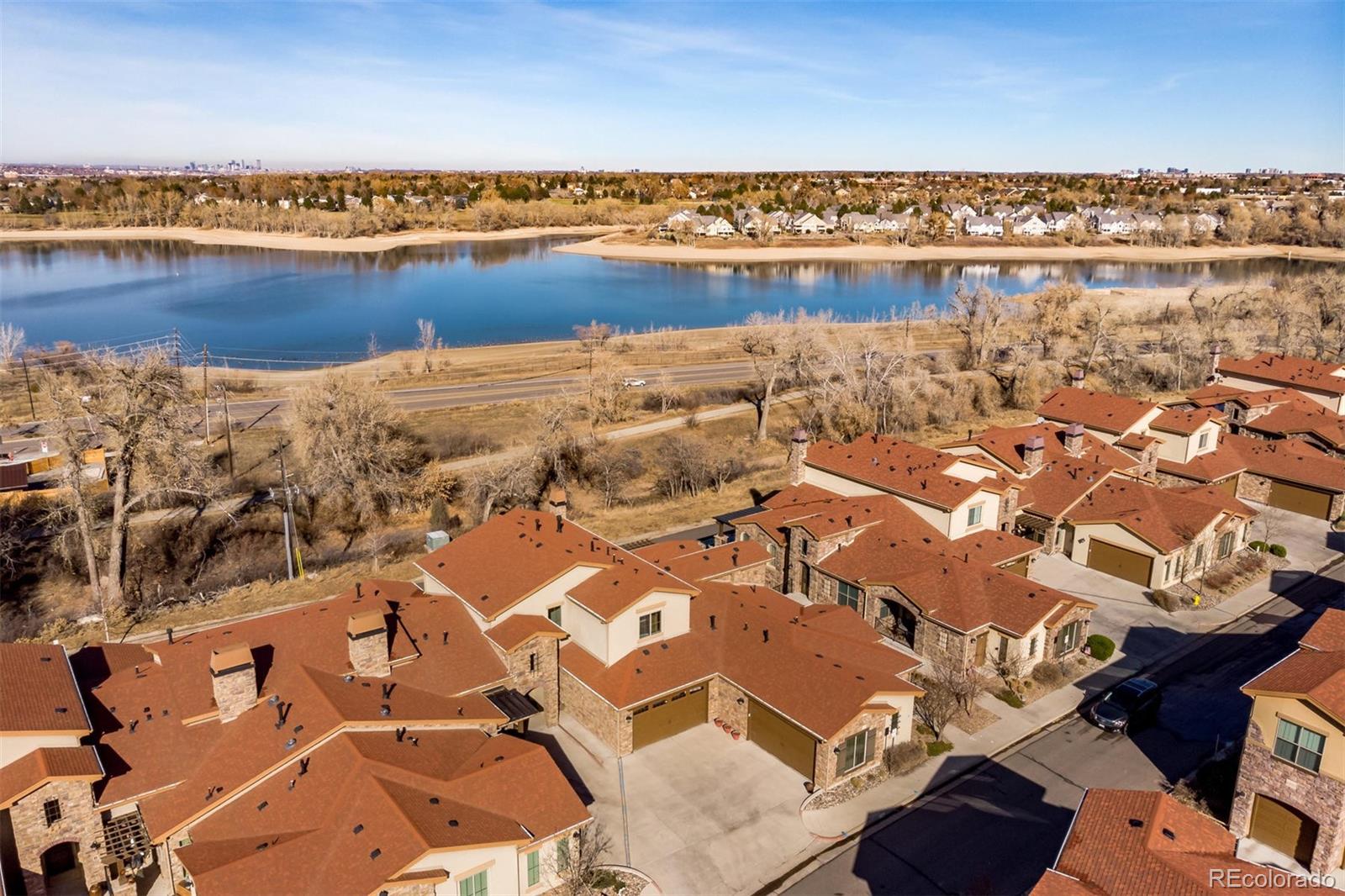 2363 Primo Road, Unit E Highlands Ranch, CO 80129 - Photo 35 of 36 an aerial view of a building with outdoor space lake view and mountain view