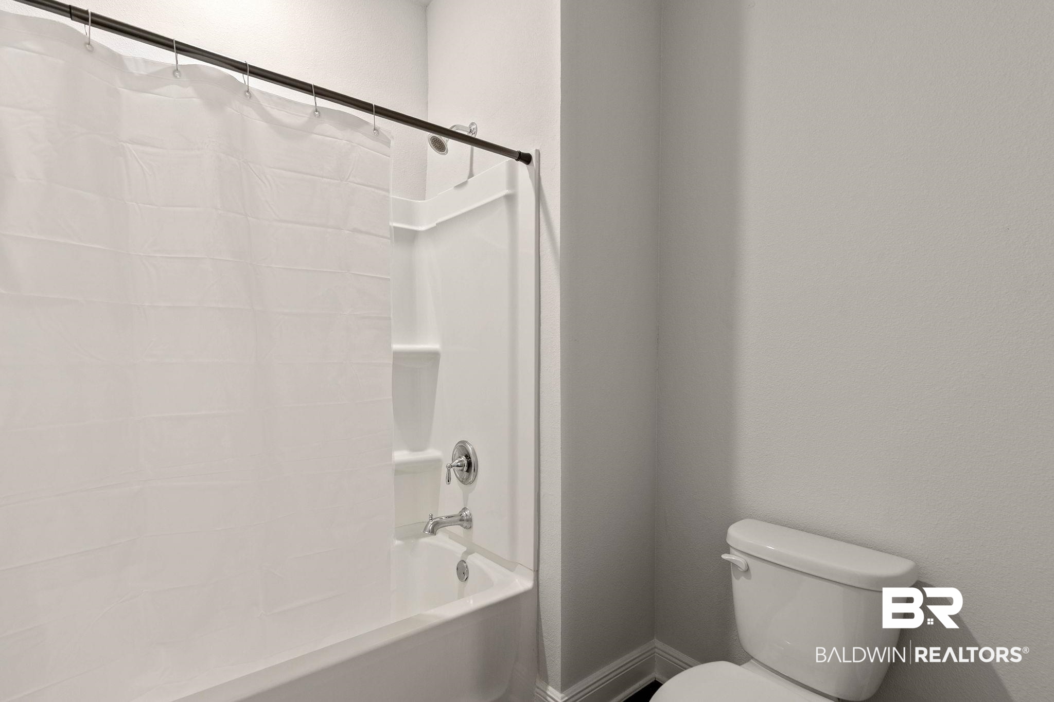 9448 Amethyst Drive Daphne, AL 36526 - Photo 37 of 61 Full bath featuring toilet and shower / bath combo with shower curtain