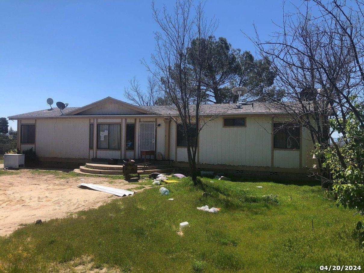 52255 Wheeler Road Anza, CA 92539 - Photo 1 of 9 a backyard of a house with yard and outdoor seating