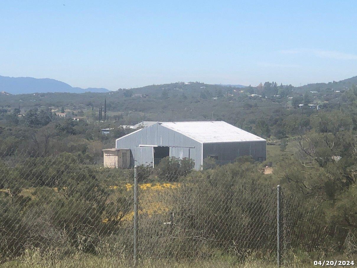 52255 Wheeler Road Anza, CA 92539 - Photo 6 of 9 a view of a house with a yard and a forest