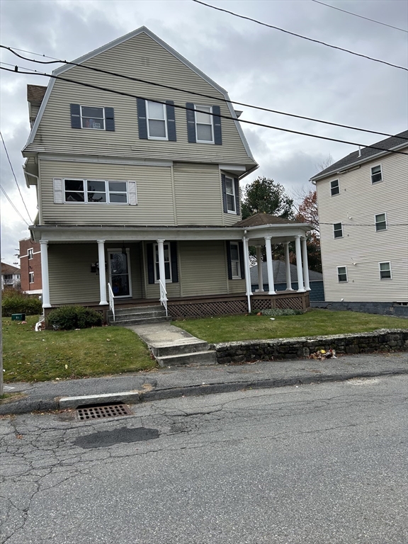 34 King Philip Road Worcester, MA 01606 - Photo 1 of 5 a front view of a house with a garden