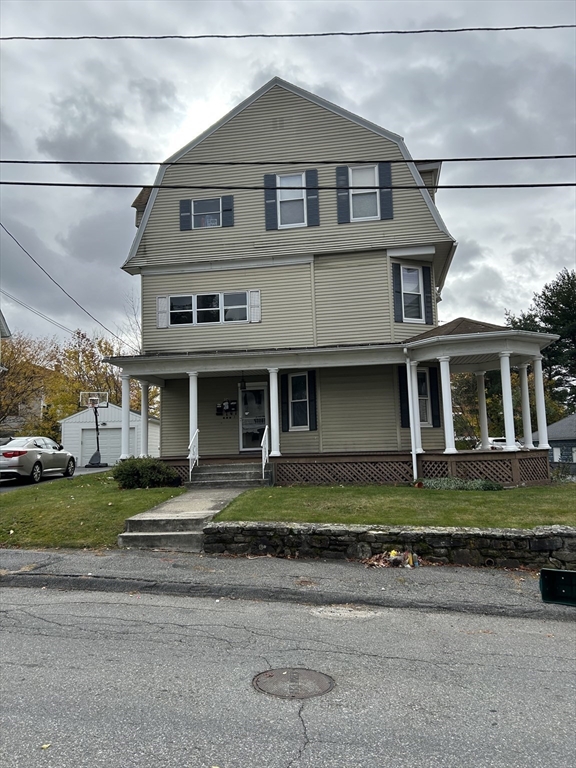 34 King Philip Road Worcester, MA 01606 - Photo 2 of 5 a front view of a house with a yard