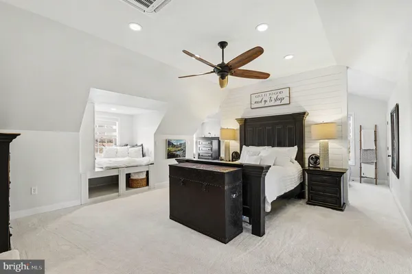 a view of living room with furniture and a ceiling fan