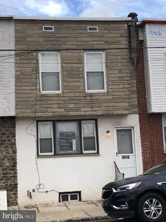 a front view of a house with parking