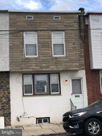 a front view of a house with parking