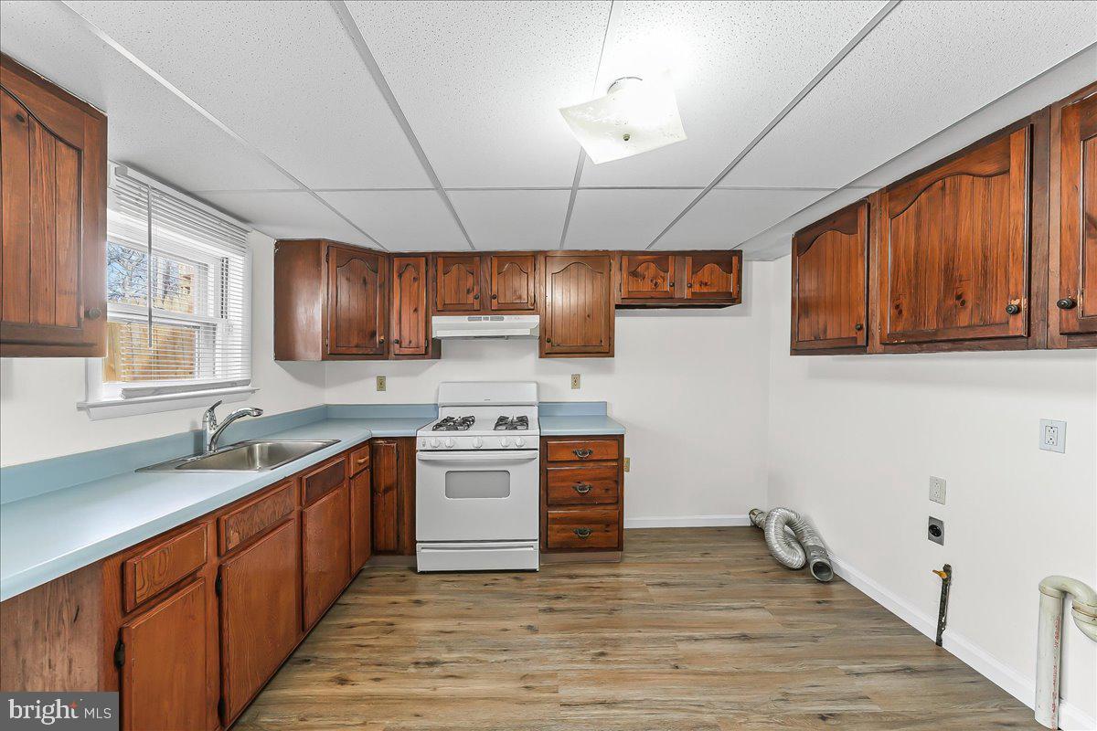 4518 Post Road Marcus Hook, PA 19061 - Photo 7 of 24 a kitchen with stainless steel appliances granite countertop a sink stove and cabinets