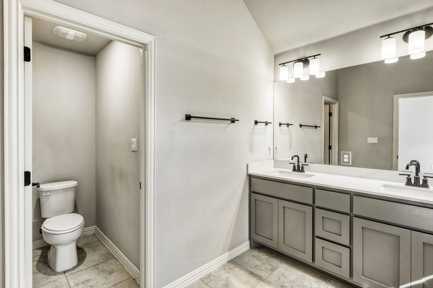 426 Cold Riv Run Kyle, TX 78640 - Photo 10 of 24 Bathroom with double vanity and water closet
