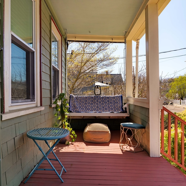 10 Gilman Street Boston, MA 02131 - Photo 2 of 41 a view of a chairs and table in the balcony