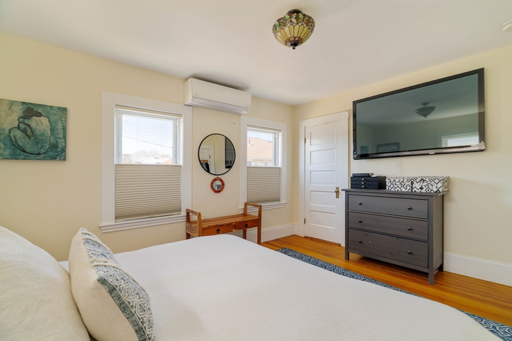 10 Gilman Street Boston, MA 02131 - Photo 25 of 41 a bed room with a bed and a television