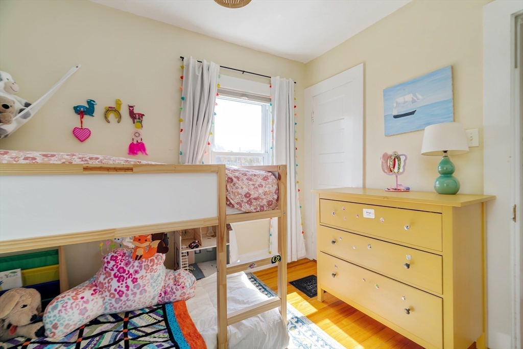 10 Gilman Street Boston, MA 02131 - Photo 26 of 41 a bedroom with a bed and furniture