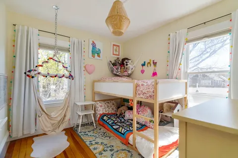 a bed room with a window and gym equipment