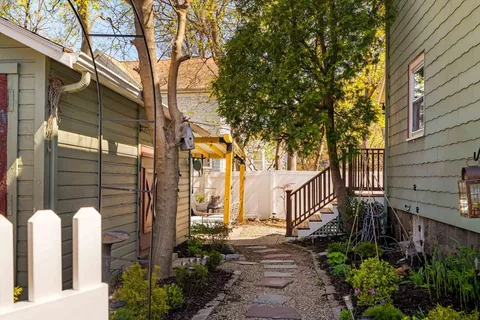 a view of a house with a backyard