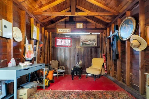 a view of livingroom with furniture and a mirror
