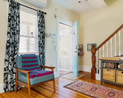 a living room with furniture and a rug
