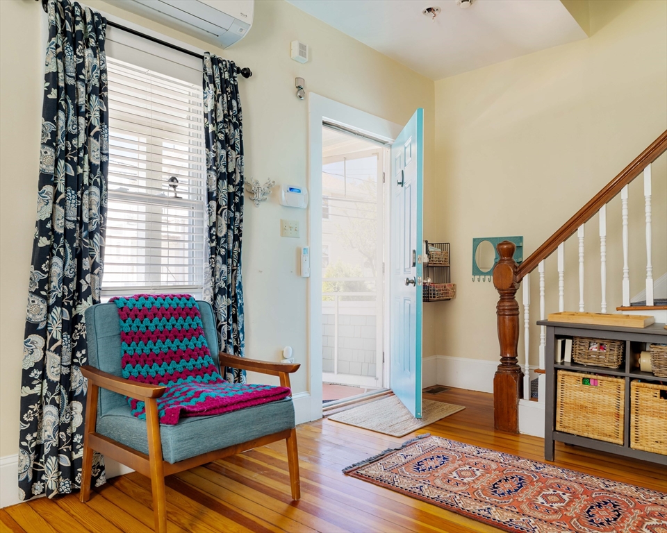 10 Gilman Street Boston, MA 02131 - Photo 3 of 41 a living room with furniture and a rug