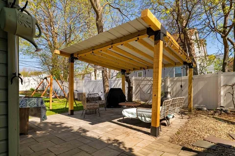 a view of a sink and table in the patio