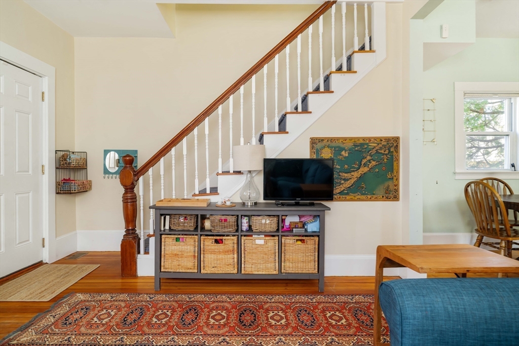 10 Gilman Street Boston, MA 02131 - Photo 6 of 41 a living room with furniture and a flat screen tv