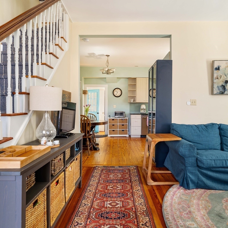 10 Gilman Street Boston, MA 02131 - Photo 8 of 41 a living room with furniture and wooden floor