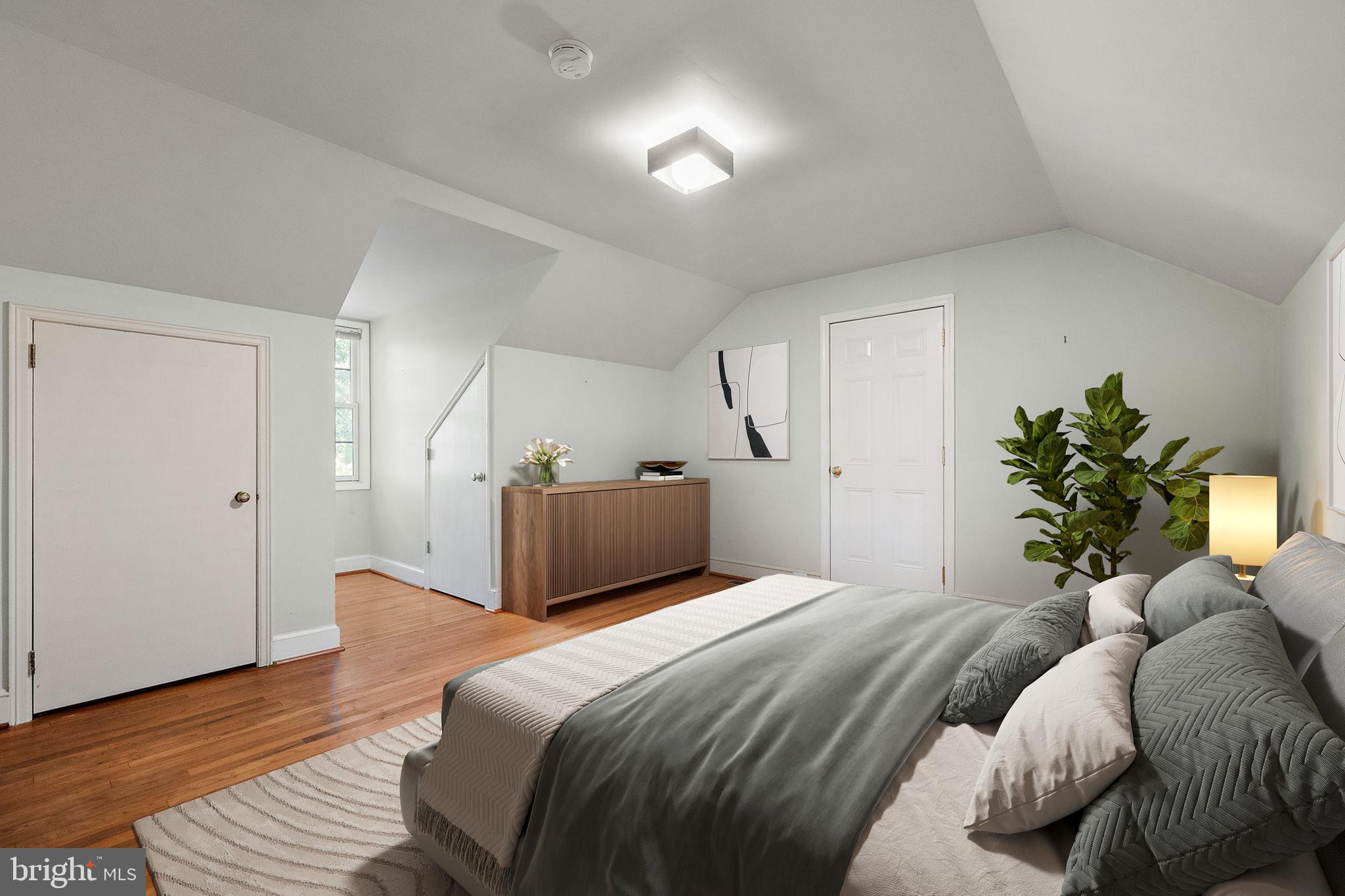 9 Granite Road Wilmington, DE 19803 - Photo 38 of 55 a bedroom with a bed and a potted plant