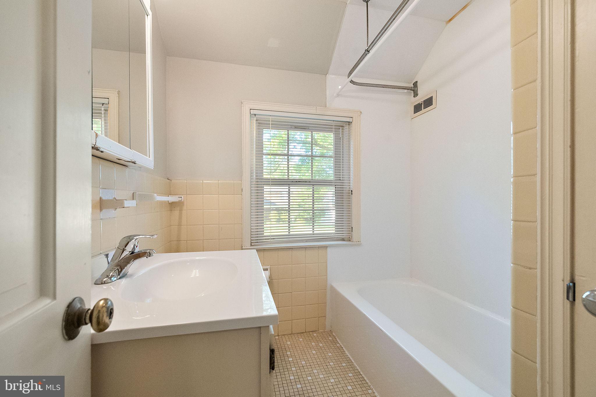 9 Granite Road Wilmington, DE 19803 - Photo 40 of 55 a bathroom with a sink and a bathtub