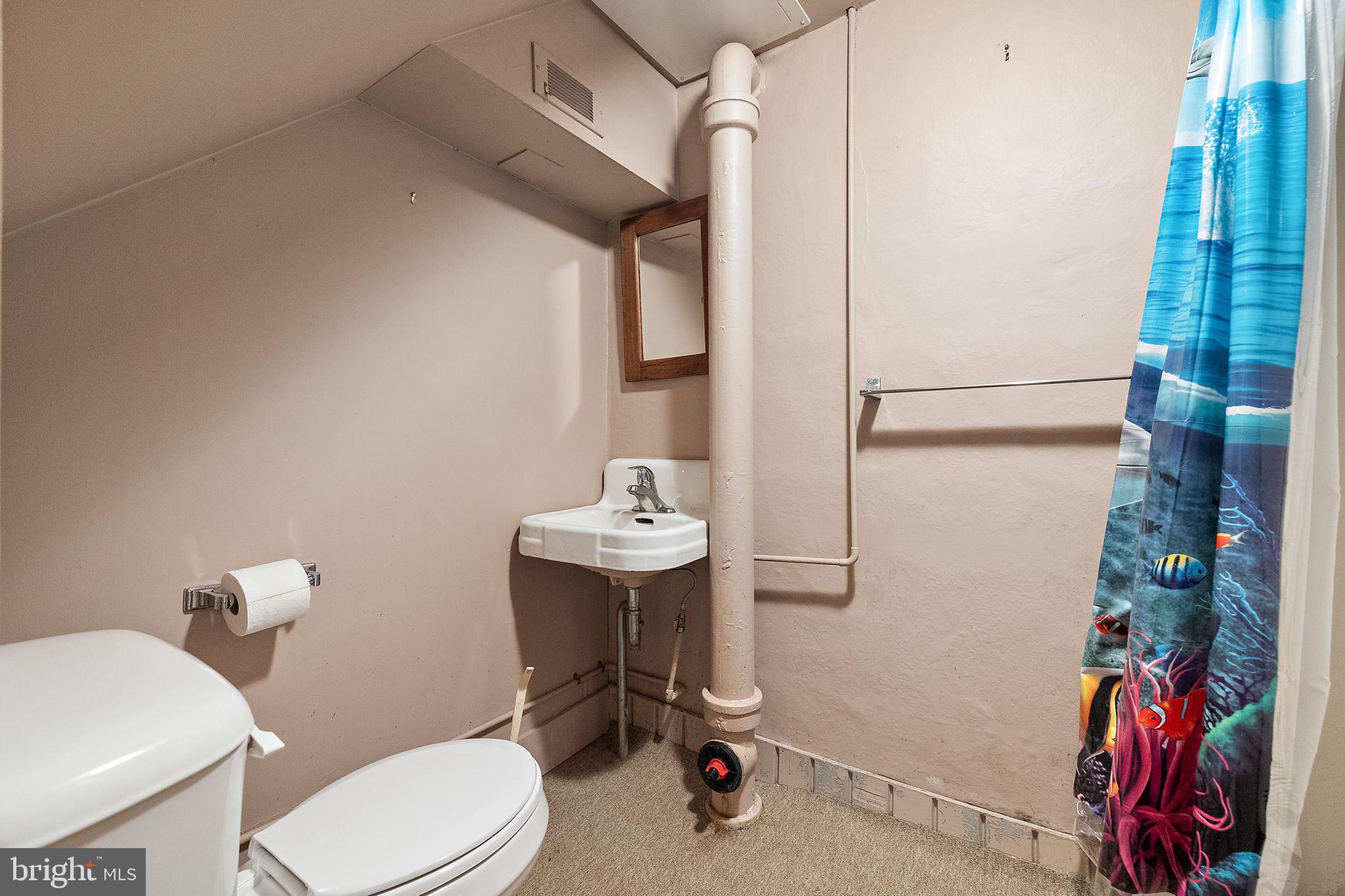 9 Granite Road Wilmington, DE 19803 - Photo 44 of 55 a bathroom with a sink a toilet and shower