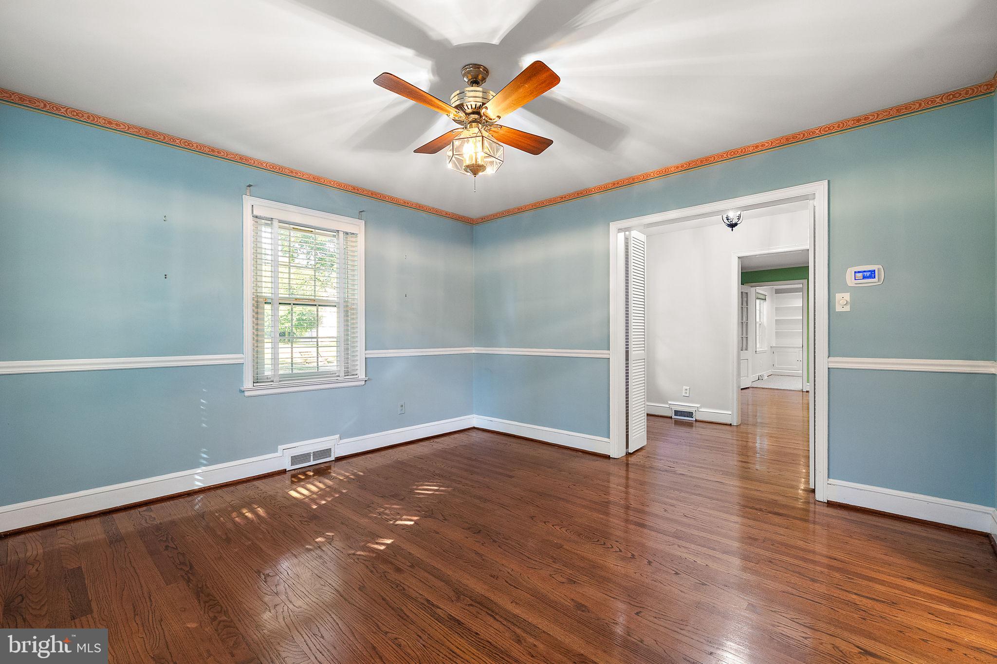 9 Granite Road Wilmington, DE 19803 - Photo 8 of 55 wooden floor in an empty room with a window