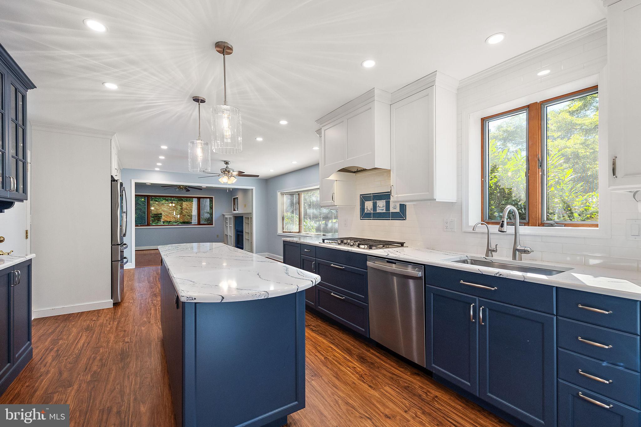 9 Granite Road Wilmington, DE 19803 - Photo 9 of 55 a kitchen with center island and wooden cabinets