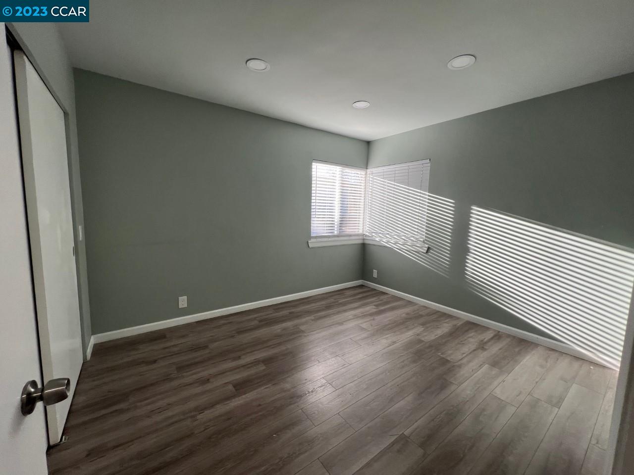 3620 Chestnut Street Lafayette, CA 94549 - Photo 15 of 19 an empty room with wooden floor and windows