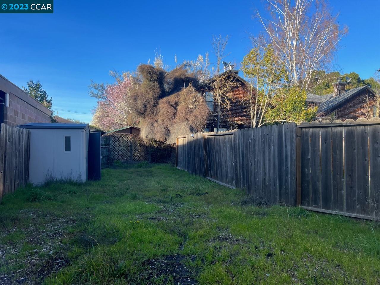 3620 Chestnut Street Lafayette, CA 94549 - Photo 2 of 19 a view of a backyard with wooden fence