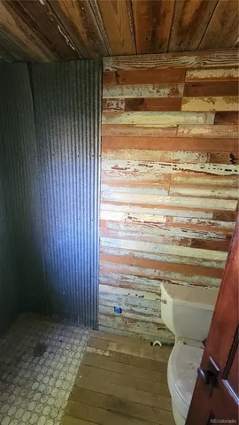 a view of empty room with window and hallway