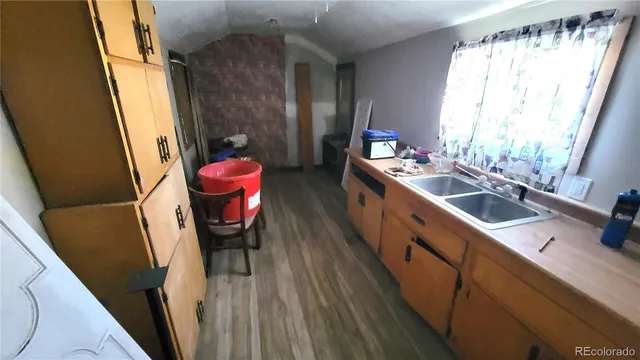 a view of room with window and wooden floor